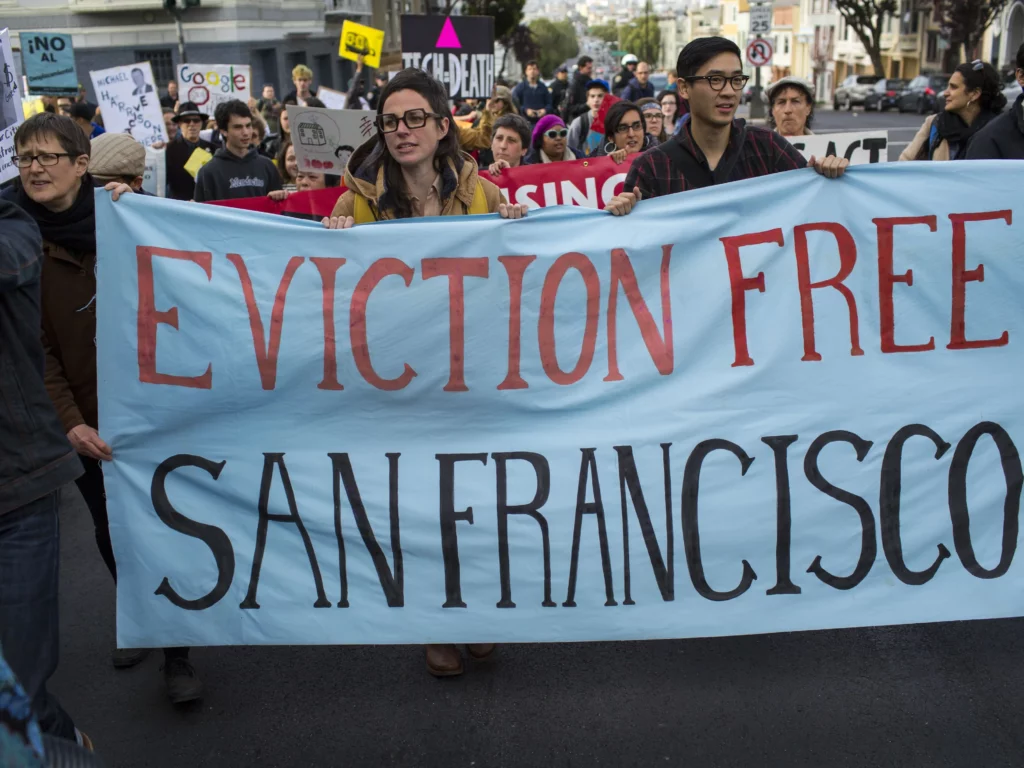 In Silicon Valley’s Shadow: How Tech Giants Fuel Gentrification and Displacement in East Palo Alto 4 | Mania Africa | maniainc.com Protestors calling for an eviction free San Francisco