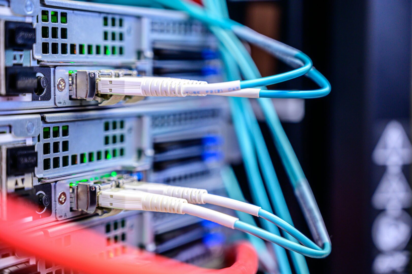Intricate network of colorful cables in a server rack, symbolizing complex data center infrastructure and the challenges of unmonitored server health - Comprehensive WordPress Server Monitoring and Troubleshooting Guide
