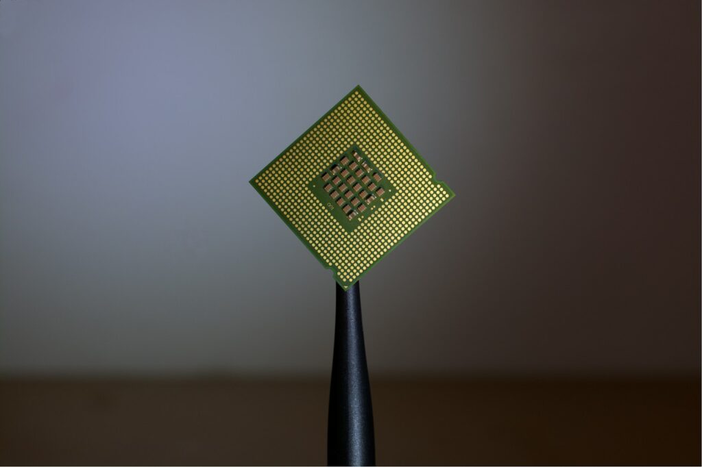 CPU-Optimized Hosting,CPU-Optimized Server,WordPress Multisite A CPU held up on a stand - Why Your WordPress Multisite Is Slowing Down — and How CPU-Optimized Hosting Can Fix It - Mania Technology