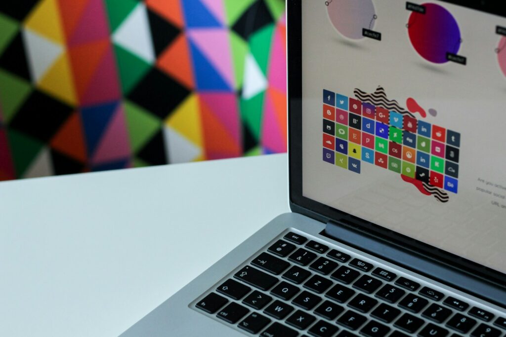 How to Optimize Your WordPress Theme (Free or Paid) for Speed, SEO, and User Experience 2 | Mania Africa | maniainc.com silver laptop computer with assorted logo screengrab - How to Optimize Your WordPress Theme (Free or Paid) for Speed, SEO, and User Experience - Mania Developers