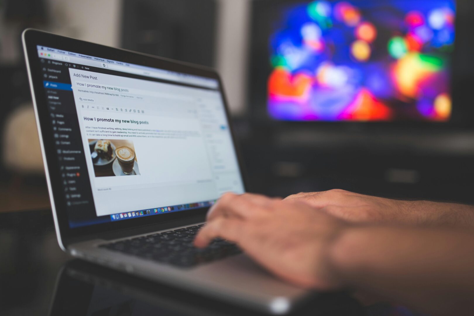 A person working on a laptop, with a WordPress-like interface on the screen, symbolizing application-level WordPress caching.