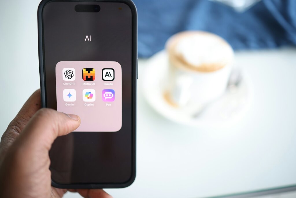 a person holding a cell phone showing ChatGPT in their hand - ChatGPT 4o: A Beloved AI Companion