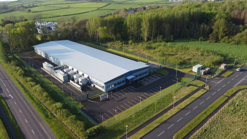 Why Google's Gemini 3.5 Pro Is Facing Delays: Inside the AI Giant's Biggest Challenge Yet—and Why OpenAI and Anthropic Are Pulling Ahead in the Agentic Coding Race 7 | Mania Africa | maniainc.com an aerial view of a large industrial building hosting a data center - The Economics of AI Are Becoming a Competitive Advantage