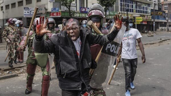 Are Kenyan Gen Z Protestors Suffering from Stockholm Syndrome? Uncovering the Emotional Toll of Fear and Repression 10 | Mania Africa | maniainc.com Police arrest an injured Gen Z protestor in Kenya | Uncovering the Emotional Toll of Fear and Repression in the Gen Z Protests | Mania Africa