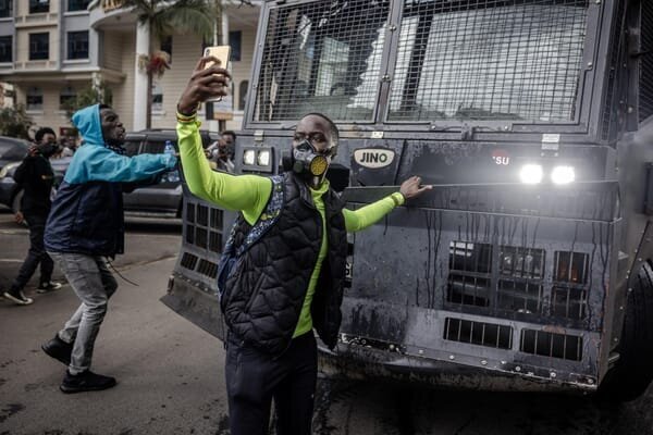 Are Kenyan Gen Z Protestors Suffering from Stockholm Syndrome? Uncovering the Emotional Toll of Fear and Repression 4 | Mania Africa | maniainc.com A Gen Z protestor filming themselves in front of a water cannon truck during the Gen Z protests in Kenya | Uncovering the Emotional Toll of Fear and Repression in the Kenyan Gen Z protests | Mania Opinion