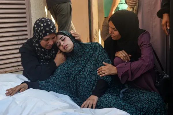 Behind the Carnage: Israeli Attack on Gaza School Claims Over 100 Lives 15 | Mania Africa | maniainc.com A Palestinian woman mourning the loss of her loved one in the Israeli attack on Al-Tabi’in School | An International Call for Action After Over 100 Dead in Al-Tabi’in School Attack | Mania News