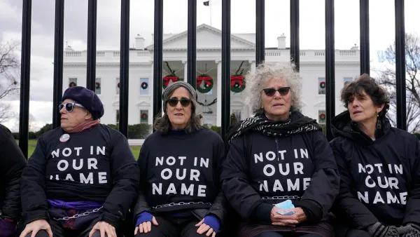 How Jews in the Diaspora View the Israeli-Palestinian War: A Documentary's Revelations 13 | Mania Africa | maniainc.com Jewish protestors outside parliament calling for an end to the Israeli-Palestinian conflict wearing t-shirts branded 'Not In Our Name' | Israelism Documentary Review | Mania Movies