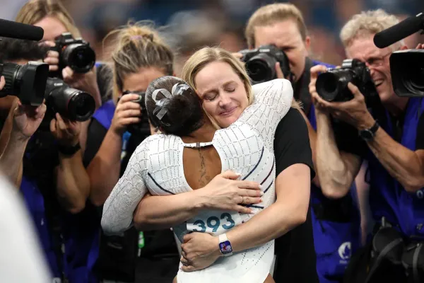 Jordan Chiles' Emotional Response to Olympic Medal Controversy 3 | Mania Africa | maniainc.com Chiles hugging her coach Cecile Landi | The Controversial Decision: Why Was Jordan Chiles' Bronze Medal Stripped Amidst Appeal Timing Controversy? | Mania News