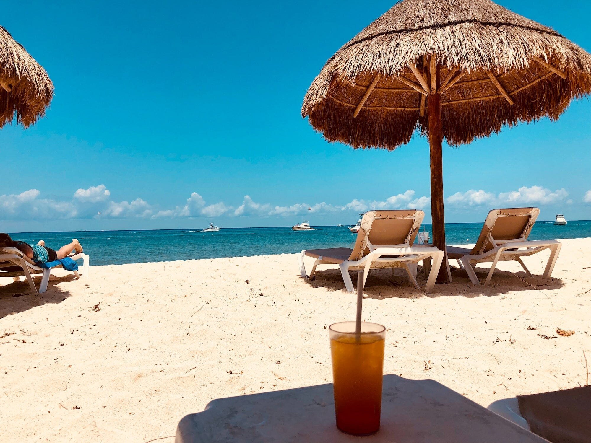 Soft Life: What it is and Why You Don't Need It 5 | Mania Africa | maniainc.com A beach with sun shades
