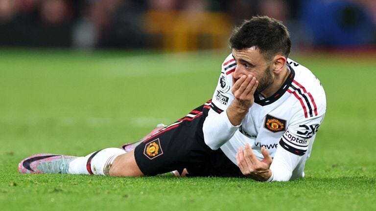 Anfield Annihilation: 7-0 is the Final Score for Liverpool vs Man United 4 | Mania Africa | maniainc.com Manchester United's Bruno Fernandes on the ground with his hand on his mouth