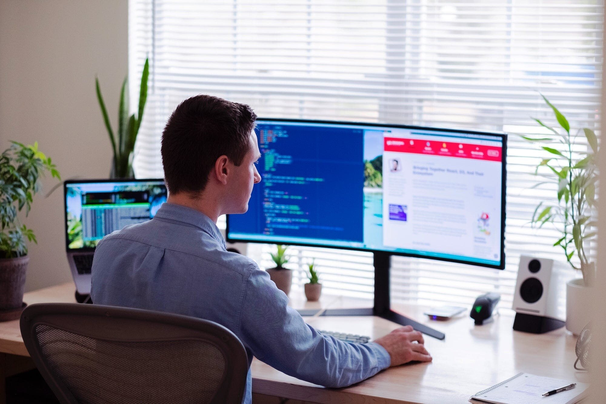 The Keys to Success on Fiverr: A Comprehensive Guide for Freelancers and Buyers 4 | Mania Africa | maniainc.com A man on his computer doing some coding as a Fiverr freelancer would