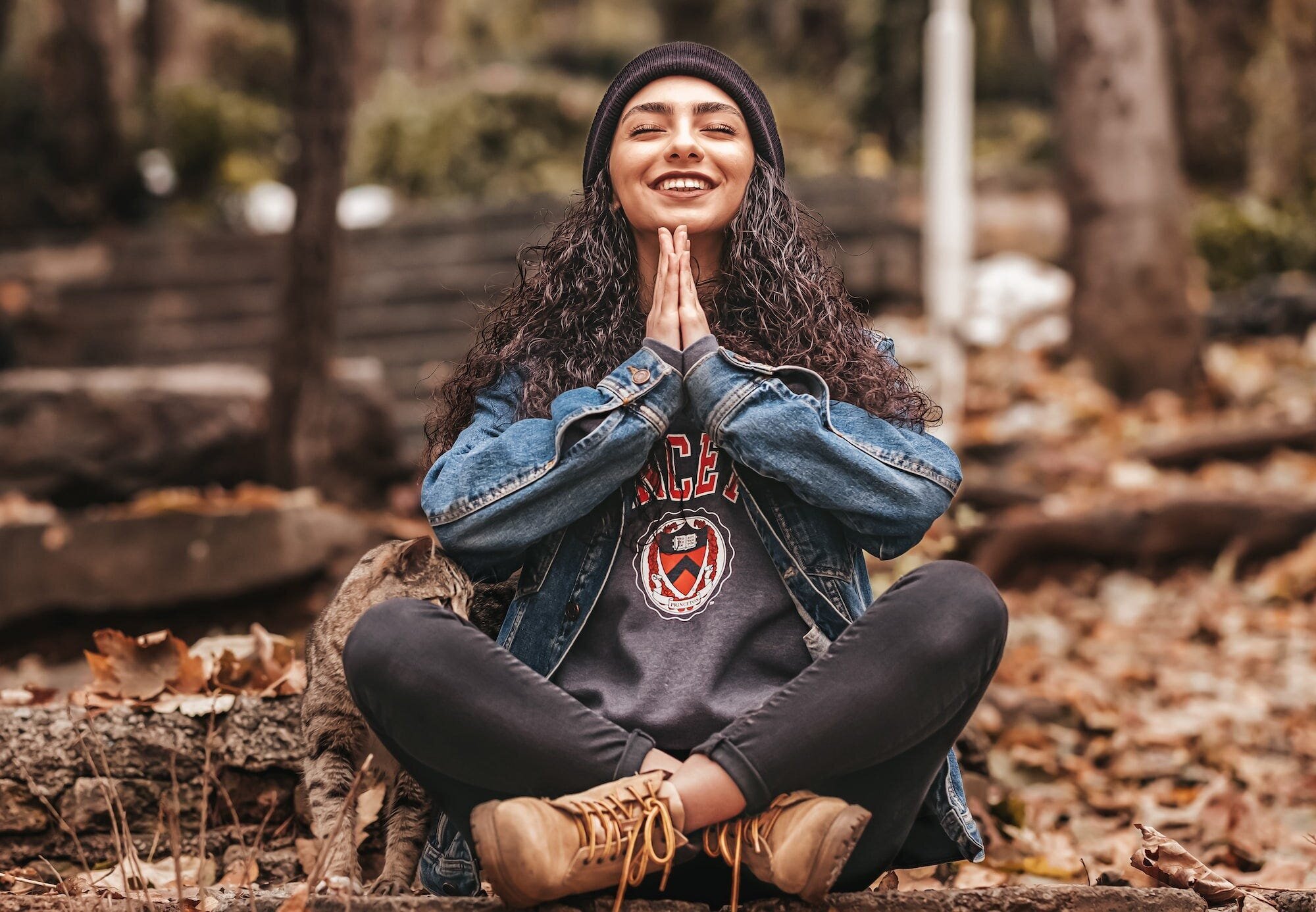 The Ultimate Guide to Meditation for Stress and Anxiety Relief 4 | Mania Africa | maniainc.com A woman meditating with a lovely cat next to her