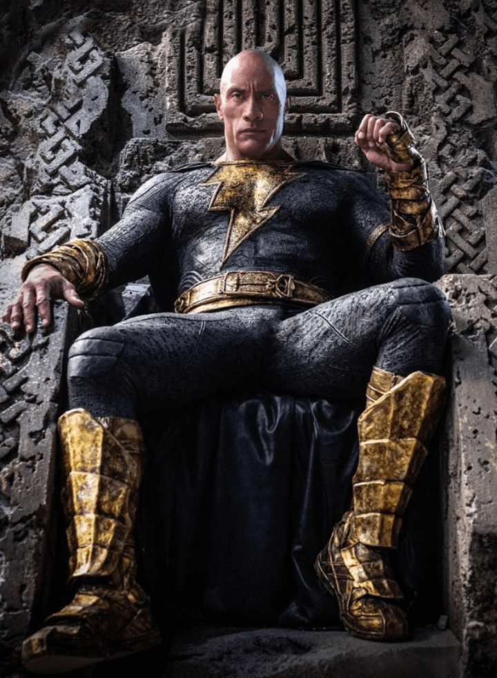 Black Adam Movie Review 8 | Mania Africa | maniainc.com Black Adam sitting on the throne in Kahndaq