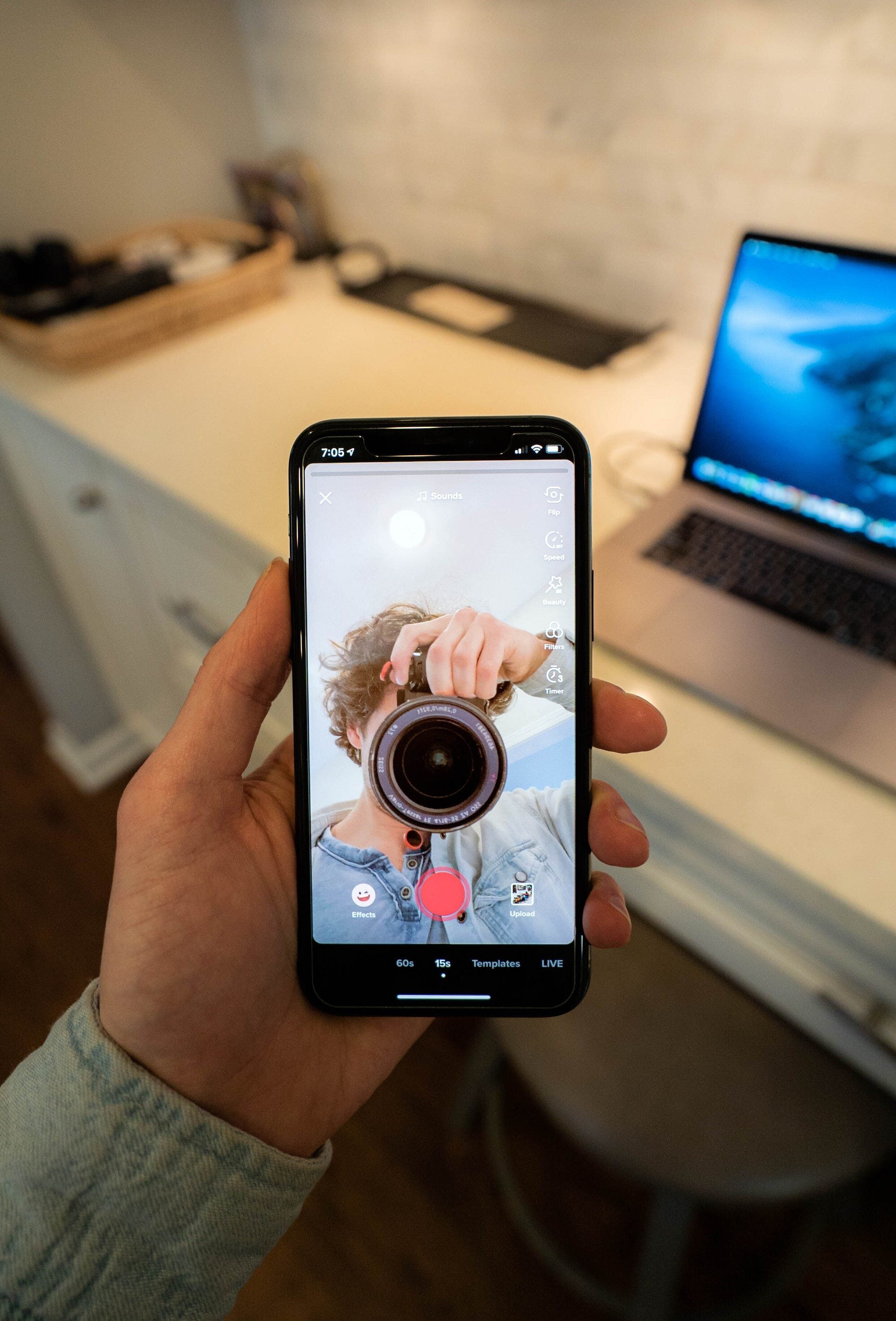 How Safe Are Your Secrets on TikTok? Examining the Connection between ByteDance, China, Social Media, and U.S. National Security 2 | Mania Africa | maniainc.com Taking a selfie while recording a TikTok