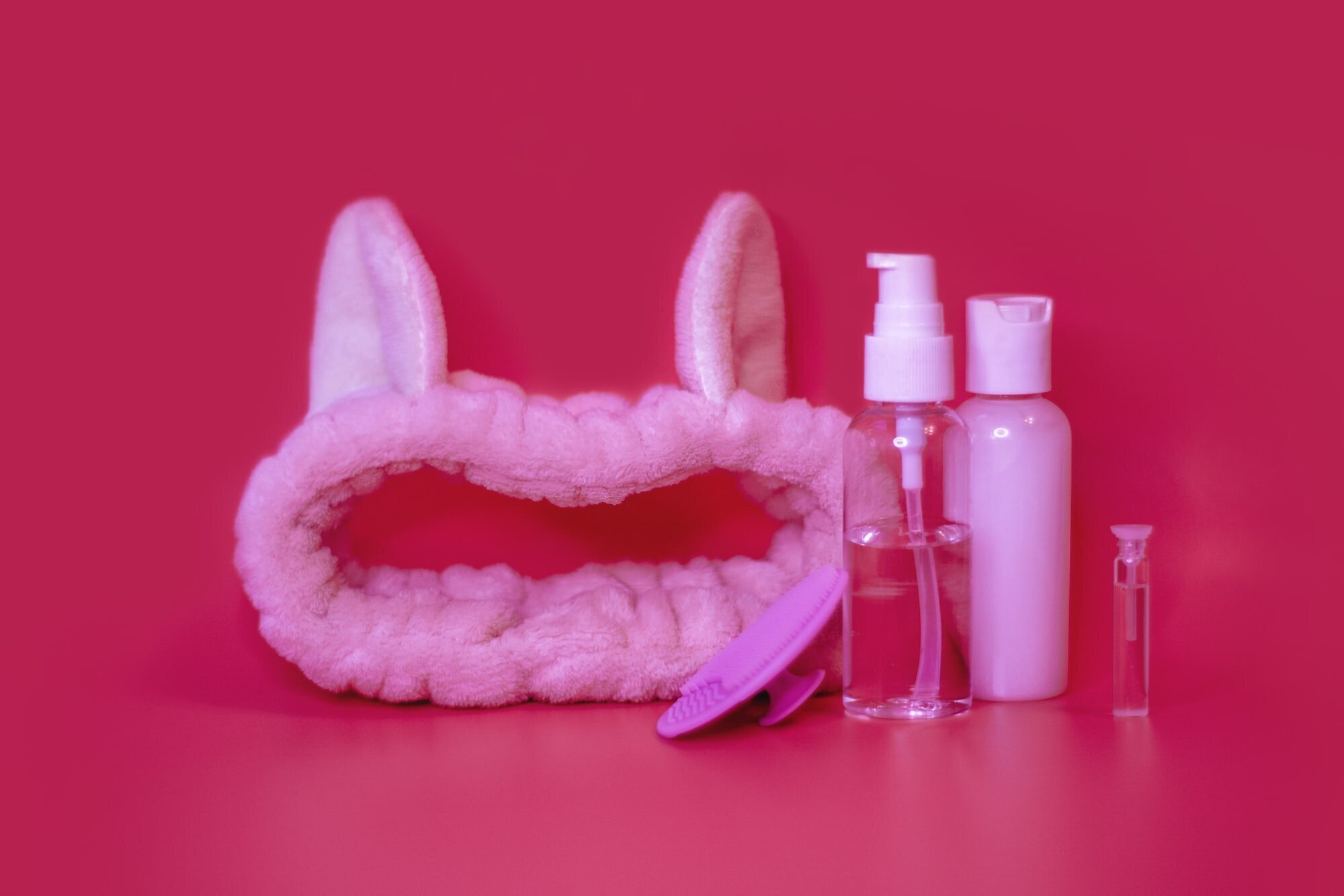 Unlock the Secret to Healthy and Shiny Locks: The Ultimate Hair Care Routine 2 | Mania Africa | maniainc.com A headband with bunny ears alongside hair care products