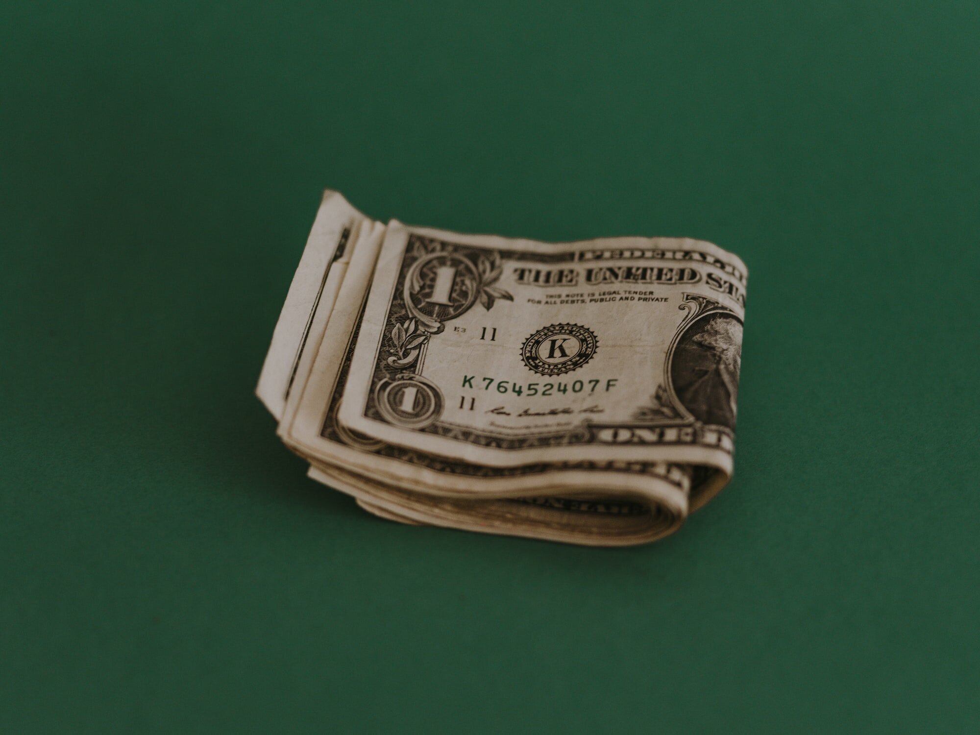 Get Started on Substack and Succeed: A Comprehensive Guide for Writers - Tips on Writing, SEO, Income, and Promoting Your Content 4 | Mania Africa | maniainc.com An image of folded dollar bills on a green background