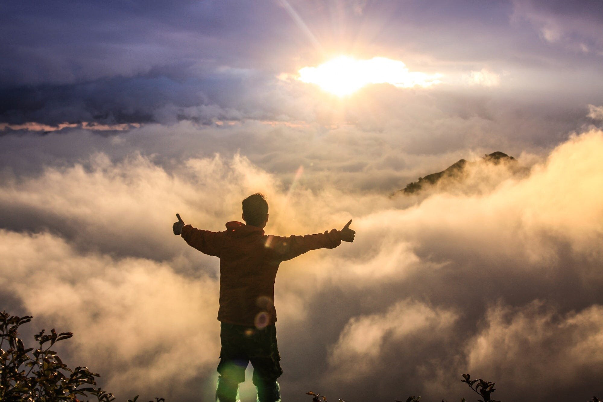 Are Happiness and Life Transient? Examining the Debate and the Role of Perspective 4 | Mania Africa | maniainc.com An individual spending their morning on top of a mountain trying to gain some perspective and find their happiness