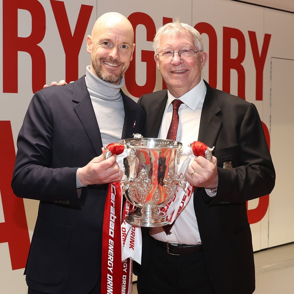 Sir Alex Ferguson and Arsene Wenger Inducted into Premier League Hall of Fame 4 | Mania Africa | maniainc.com Sir Alex Ferguson with Man Utd manager Erik ten Hag, both holding the Carabao Cup Trophy