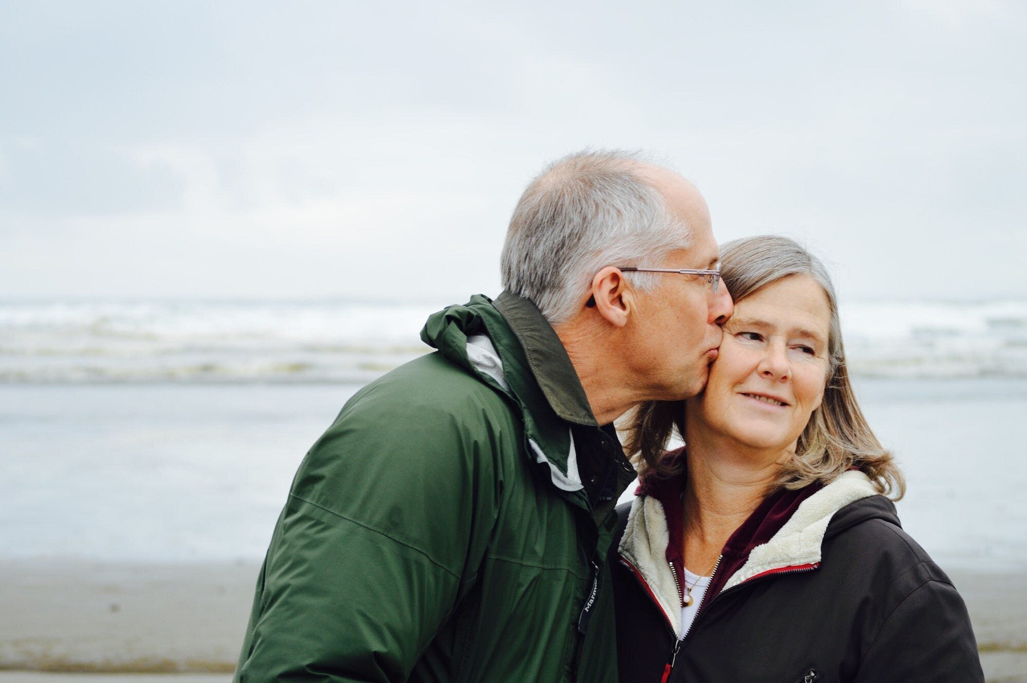 Exploring the Power of Thought: From Brain-Machine Interfaces to Genetics and Aging 4 | Mania Africa | maniainc.com An image of an elderly couple with the man kissing his wife on the cheek