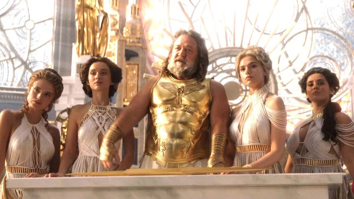 Thor: Love and Thunder Movie Review 5 | Mania Africa | maniainc.com Zeus in Omnipotence City surrounded by his mistresses
