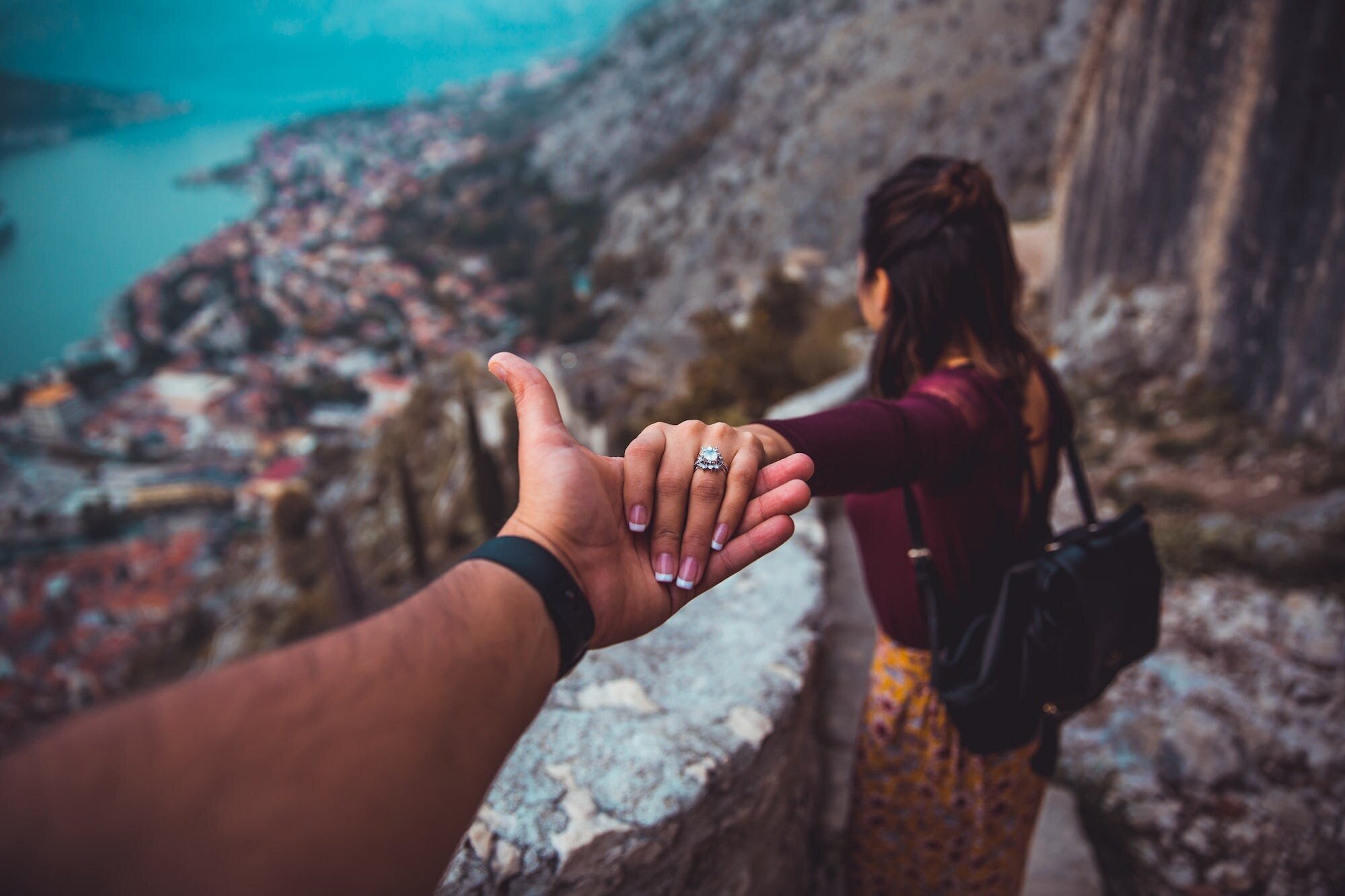 How to Move On After a Breakup When You Still Love That Person: A Comprehensive Guide to Healing and Letting Go 3 | Mania Africa | maniainc.com An image of a couple holding hands on a descent at the Castle Of San Giovanni