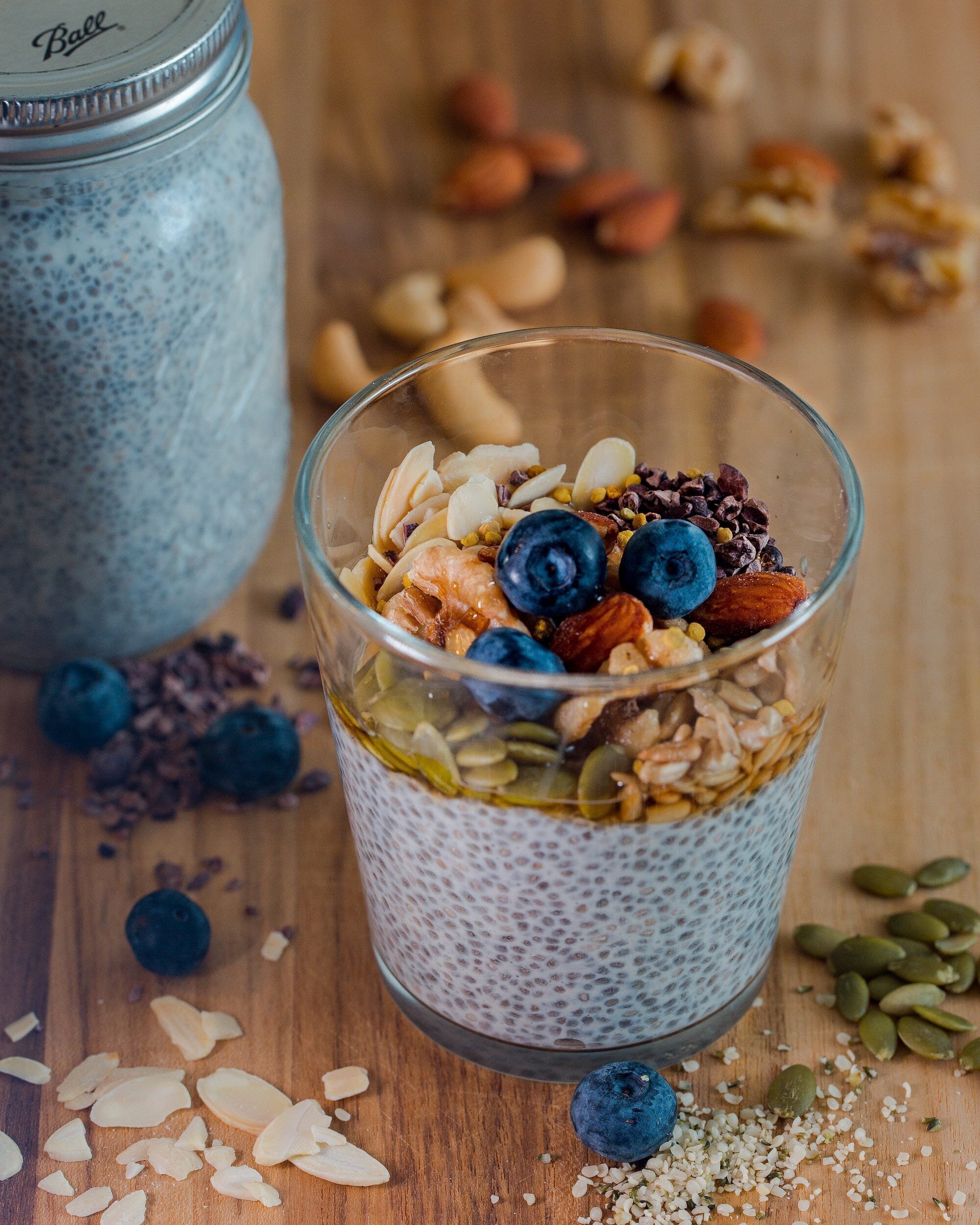 Vegan Nutrition 101: How to Get All the Nutrients You Need on a Plant-Based Diet 4 | Mania Africa | maniainc.com A glass with a smoothie partly made from chia seeds with a jar of the seeds on the side