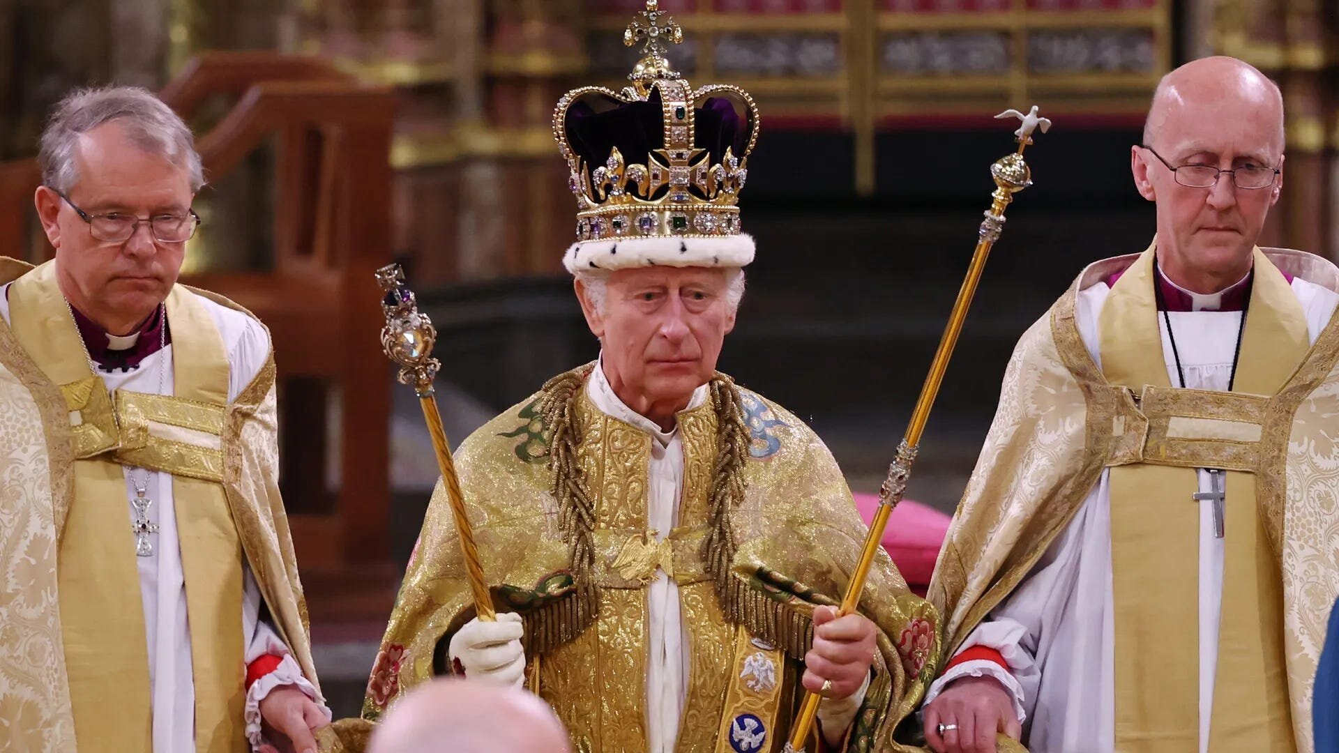 Oh Charles, King Charles,... and Your Uncomfortable Queen 3 | Mania Africa | maniainc.com King Charles III holding the instruments of power at his coronation