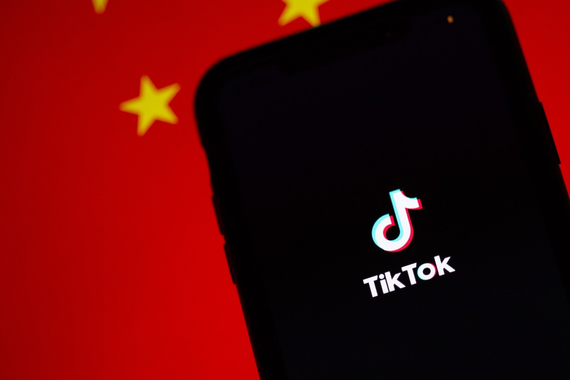 The US State of Montana Set to be the First to Ban TikTok 2 | Mania Africa | maniainc.com An image of TikTok running on an iPhone with the Chinese flag displayed behind it