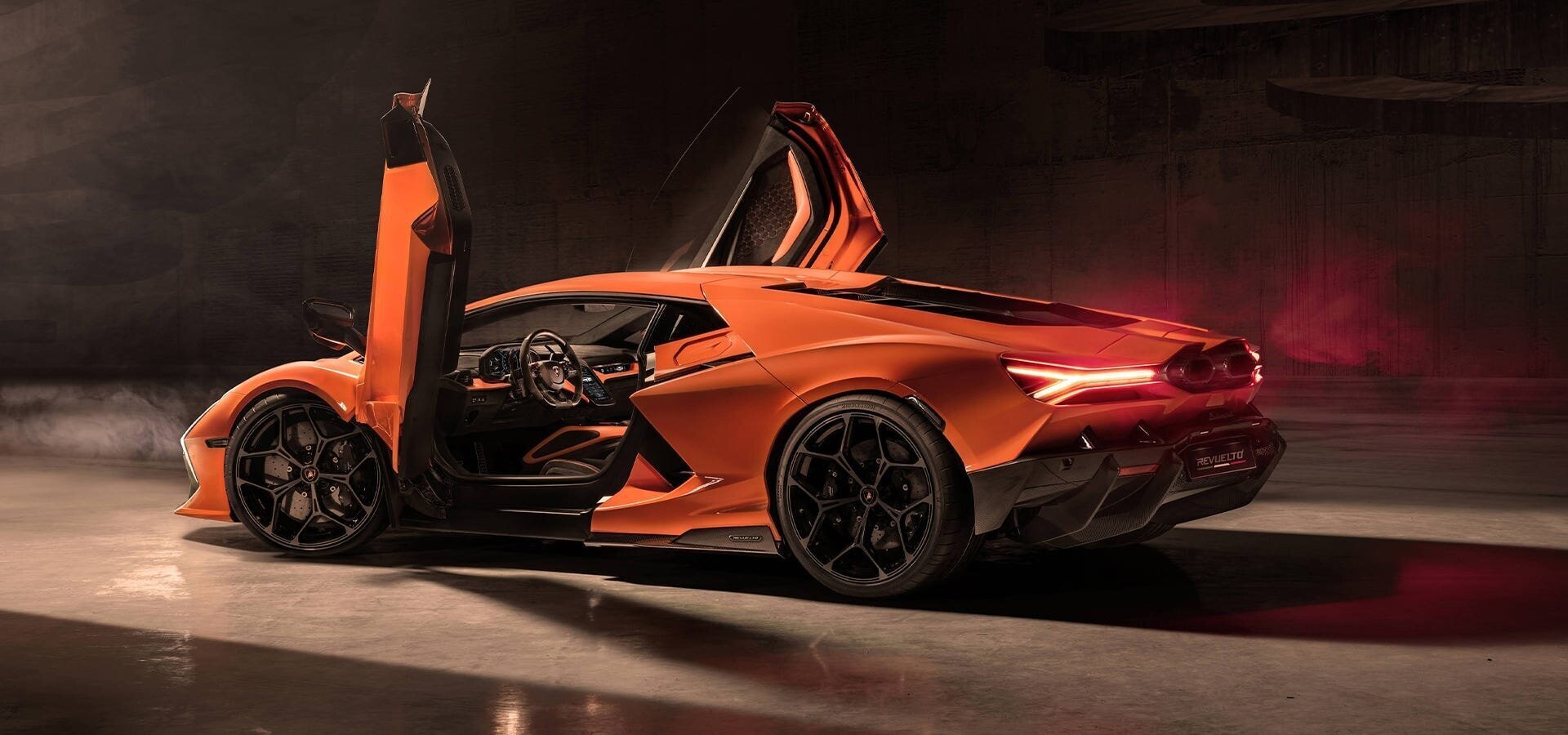 Lamborghini Revuelto: A Futuristic Hybrid Supercar for Eco-Conscious Drivers 4 | Mania Africa | maniainc.com A sideview image of the Lamborghini Revuelto with its doors open