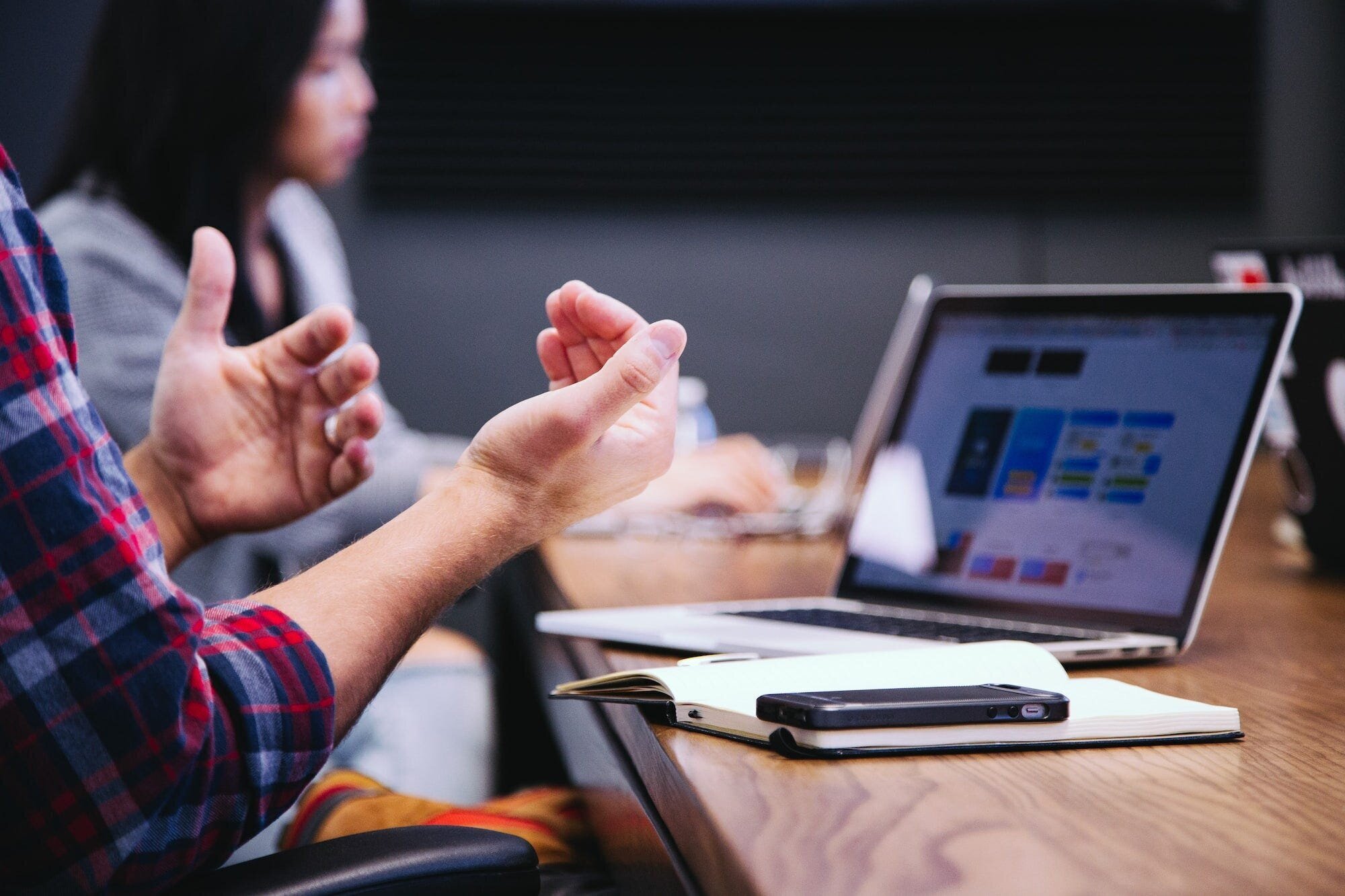 Backlinks and SEO: The Importance of High-Quality Links and Best Practices for Building Them 8 | Mania Africa | maniainc.com An image of two individuals seating at a table with a laptop open and both with notebooks