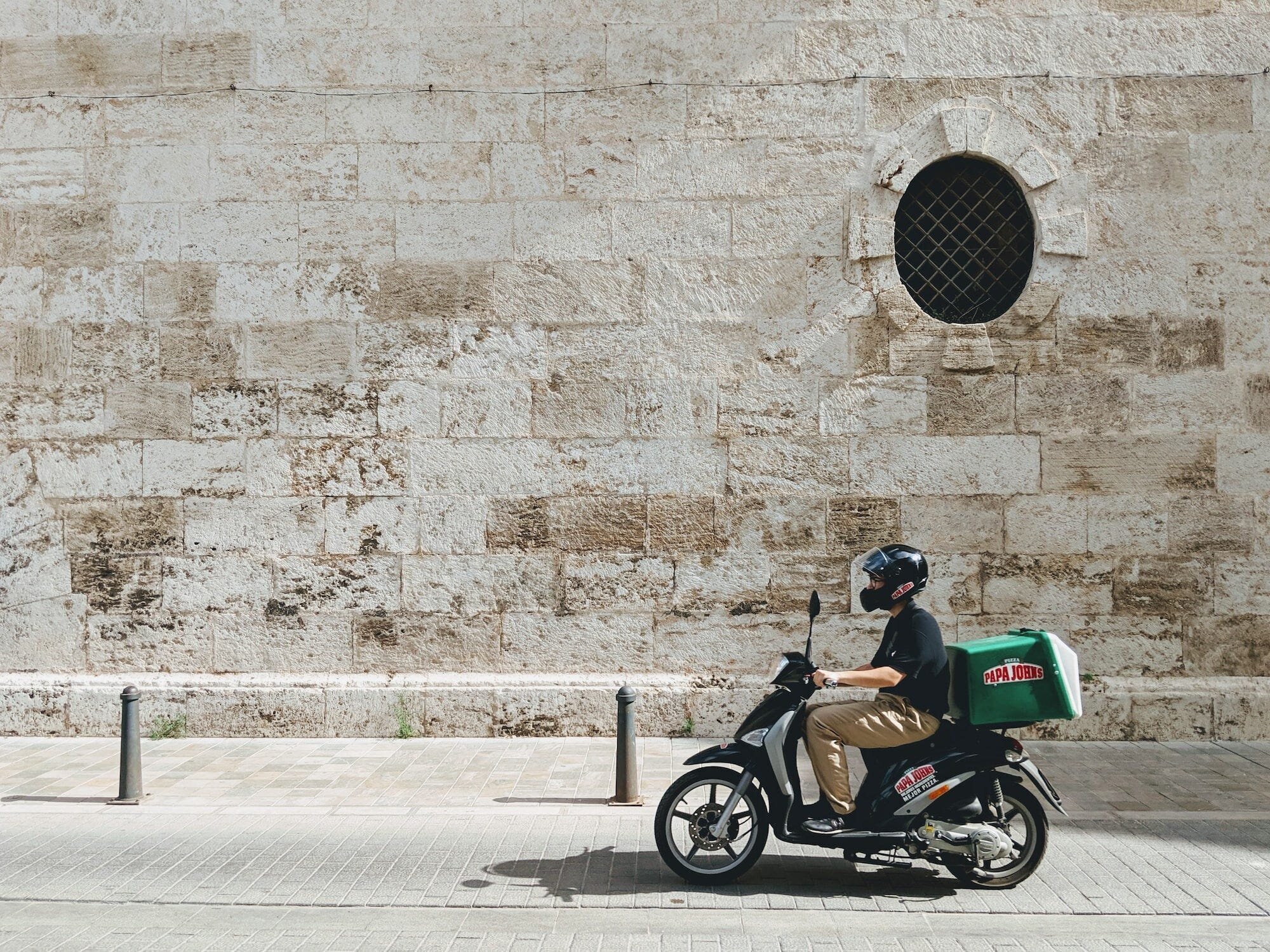 The Future of Food: Key Trends and Innovations Shaping the Industry 3 | Mania Africa | maniainc.com A delivery boy on the old streets of Valencia on a scooter