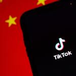 US Supreme Court Upholds TikTok Ban Citing National Security Concerns 22 | Mania Africa | maniainc.com A TikTok app on a phone infront of the Chinese flag