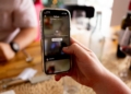 A phone showing the TikTok App with content censored - Unveiling TikTok's Alleged Anti-Trump Censorship – What Users Need to Know