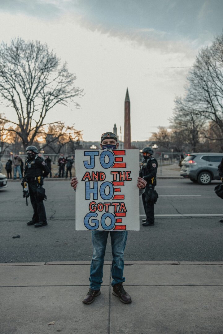 Thank You, Joe Biden. Next Please! Why I Think Joe Biden Should Retire 3 | Mania Africa | maniainc.com A protestor wielding a not-so-kind placard | Why I Think Joe Biden Should Retire | Mania Africa