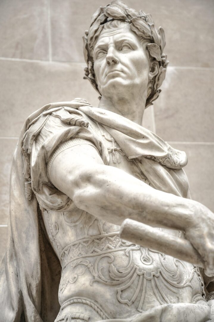 Why I Think About the Roman Empire 7 | Mania Africa | maniainc.com A sculpture of emperor Gaius Julius Caesar in Rome, Italy