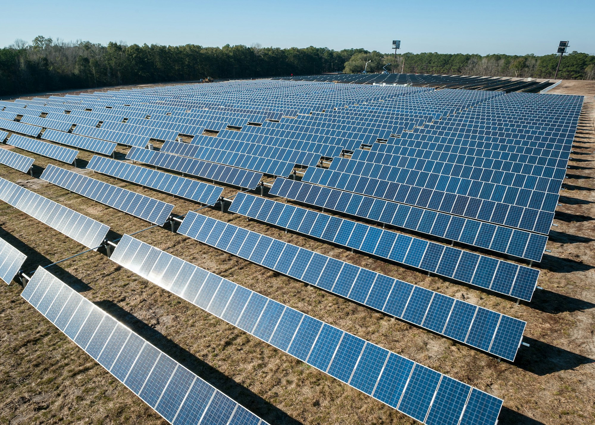 The Urgent Realities of Climate Change: Facts and Solutions for a Sustainable Future 18 | Mania Africa | maniainc.com an array of solar panel boards | Tapping Solar Energy as a way to Ensure Climate Sustainability | Climate Change on Mania Africa