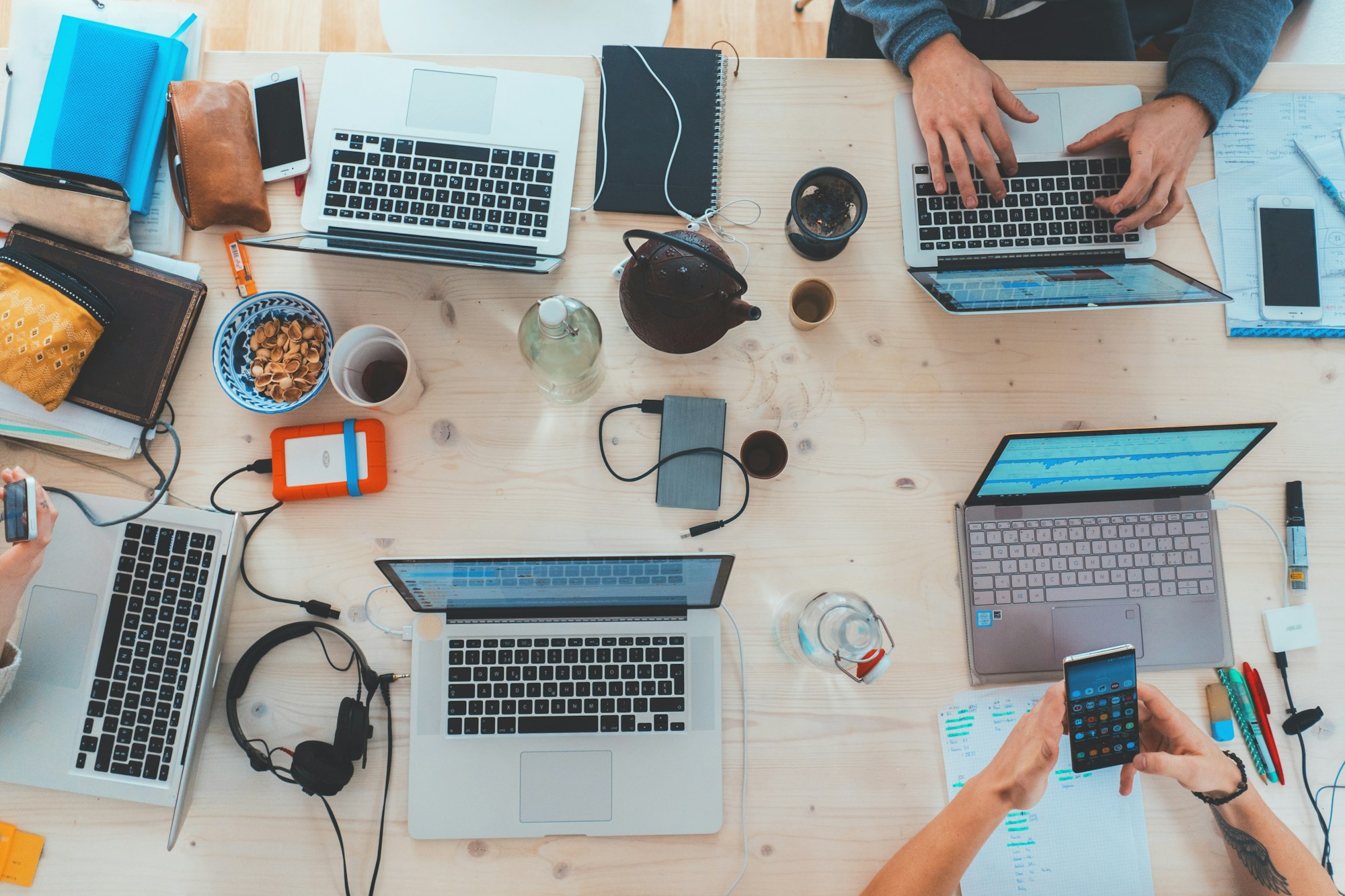 Choosing the Right Web Hosting Provider: A Comprehensive Guide to Finding Your Perfect Match 2 | Mania Africa | maniainc.com people sitting down near a table with assorted laptop computers | What Factors Should You Consider When Choosing a Hosting Provider? | Mania Developers