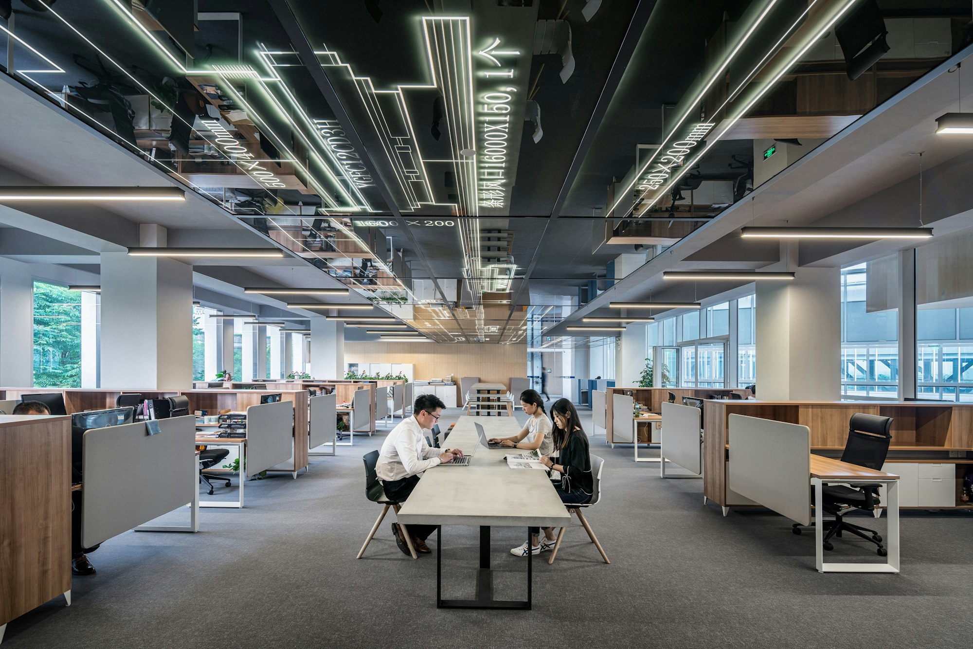 People in an office working | Challenges Facing Nations When Enforcing Sanctions | Mania Finance