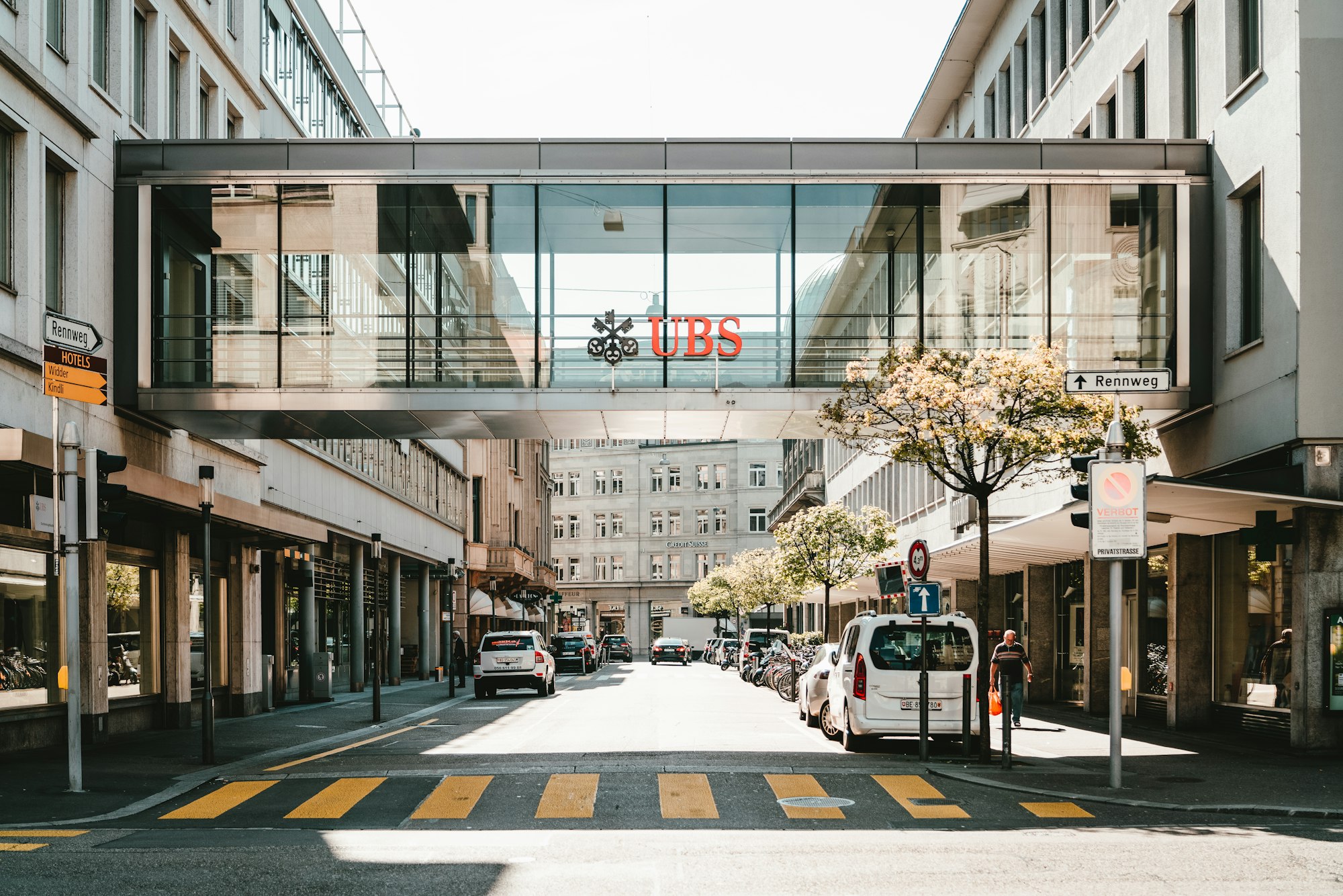UBS logo on glass bridge wall | Defunding the War on Ukraine: Is Sanctioning Russian Oligarch