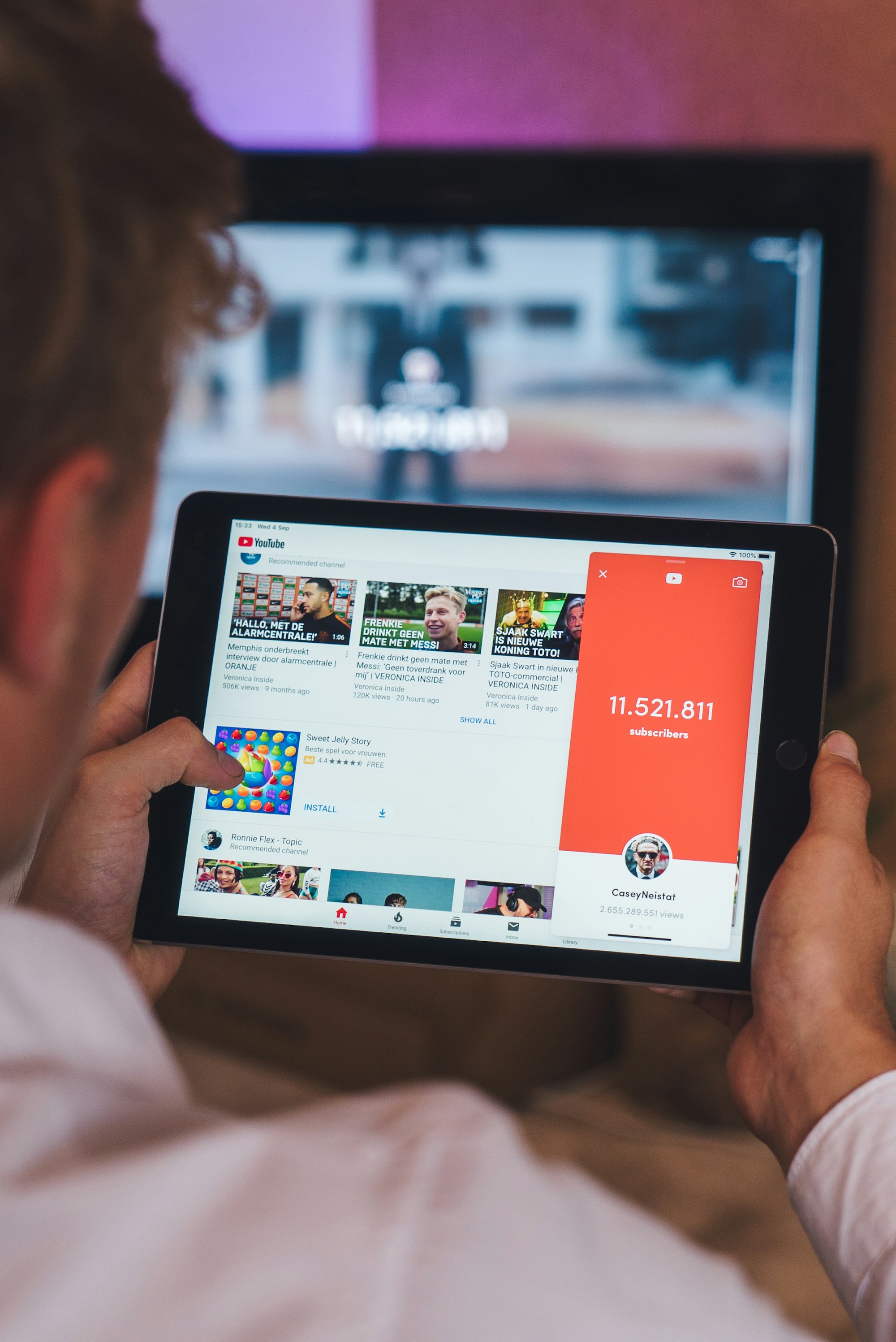 Mastering YouTube Titles: Boost Your Search Results with These Expert Tips 2 | Mania Africa | maniainc.com a person checking a YouTube channel