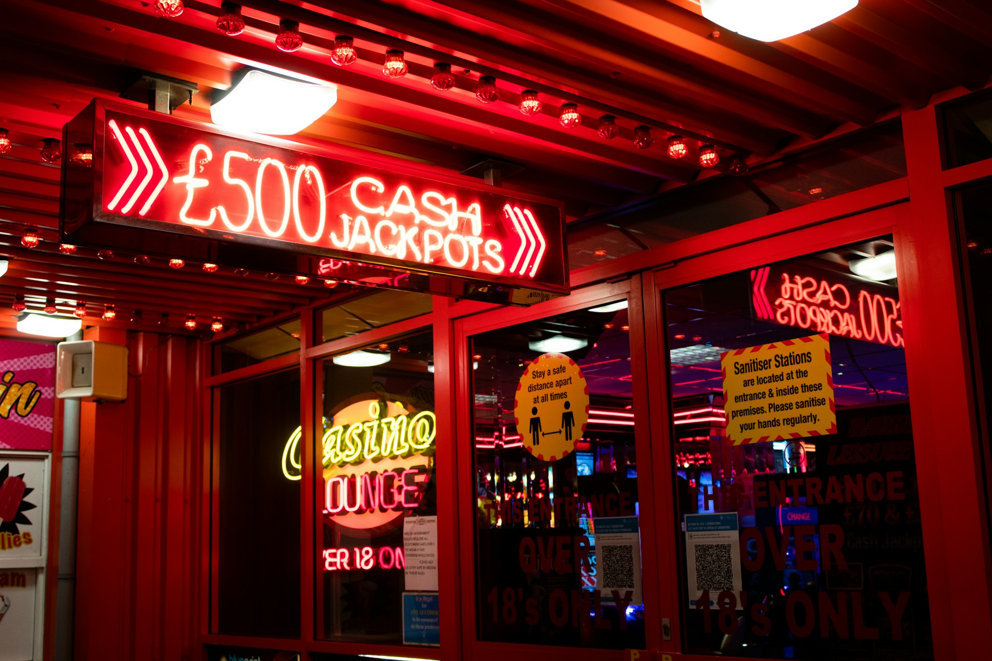 The Hidden Costs of Europe's Digital Gambling Explosion: Addiction, Exploitation, and the Quest for Reforms 25 | Mania Africa | maniainc.com neon sign outside a casino | The Reality of Betting Odds: