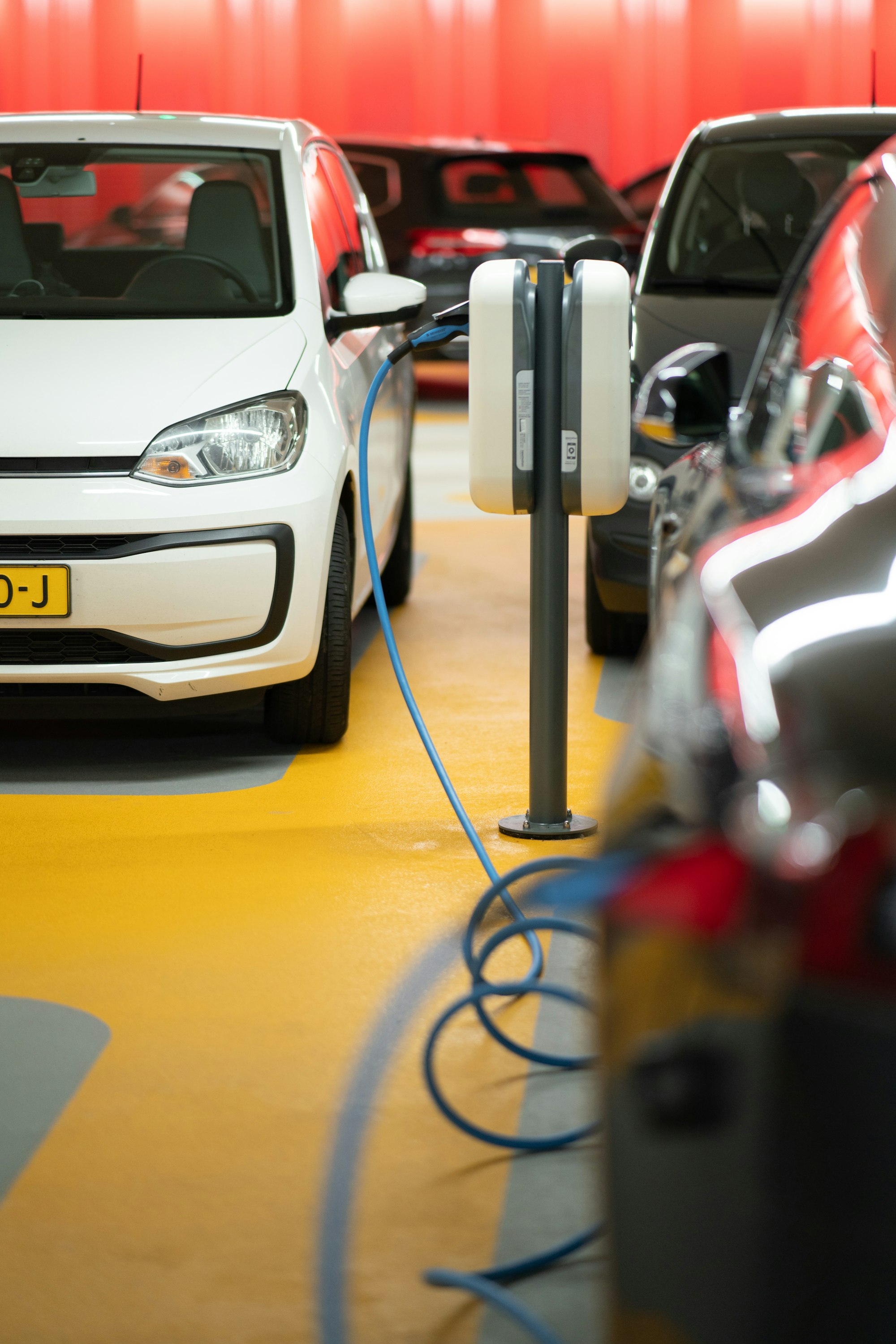 The Urgent Realities of Climate Change: Facts and Solutions for a Sustainable Future 17 | Mania Africa | maniainc.com EVs charging in a electric car charging station | Sustainable Transportation as a way to Mitigate Climate Change | Mania Science