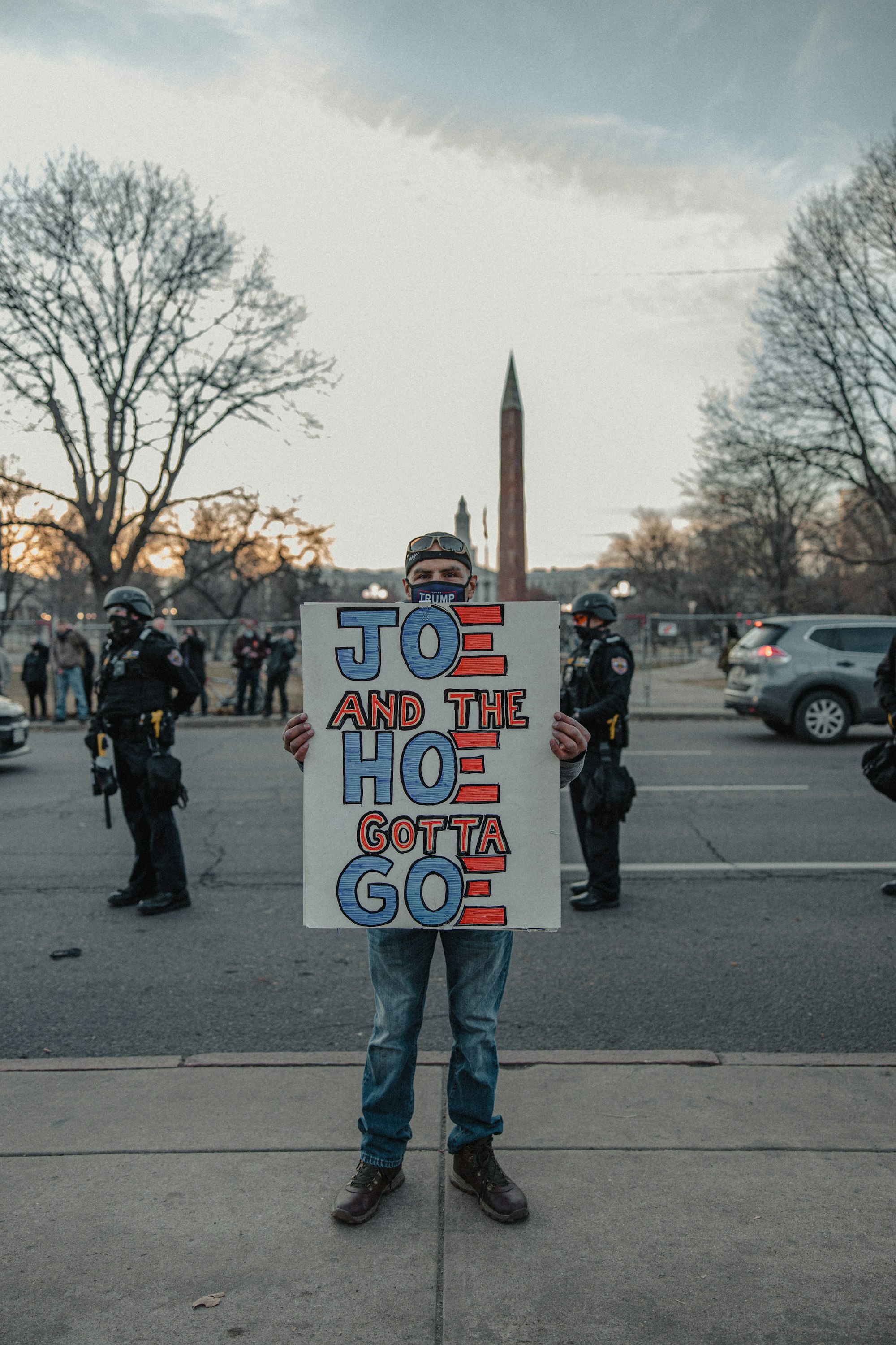 Thank You, Joe Biden. Next Please! Why I Think Joe Biden Should Retire 9 | Mania Africa | maniainc.com A protestor wielding a not-so-kind placard | Why I Think Joe Biden Should Retire | Mania Africa