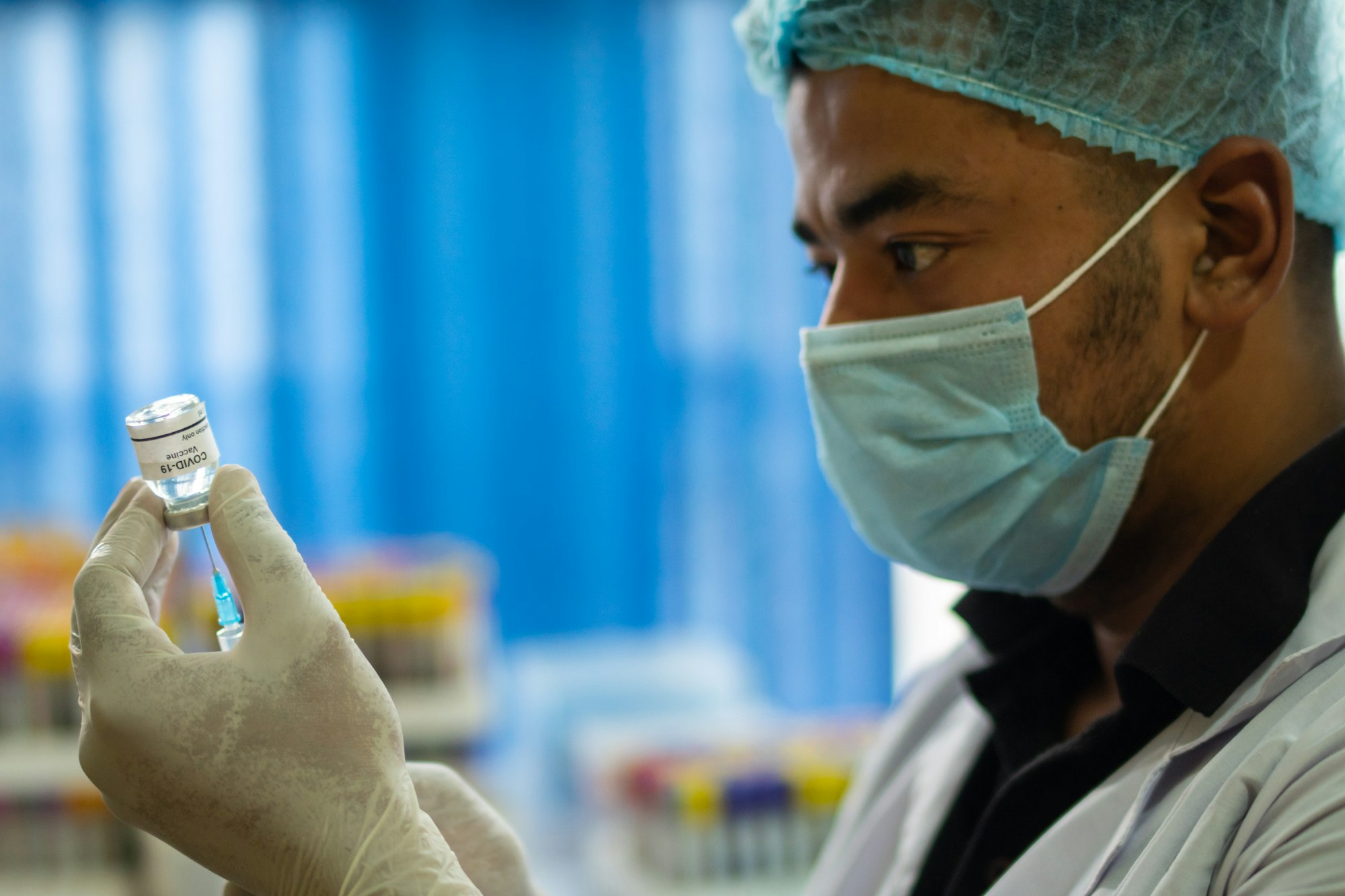 W.H.O Declares Mpox a Global Health Emergency: Critical Facts You Need to Know 13 | Mania Africa | maniainc.com A doctor with a vaccine | Must-Know Facts About the MPox Virus: Available Mpox Vaccines | Mania Health