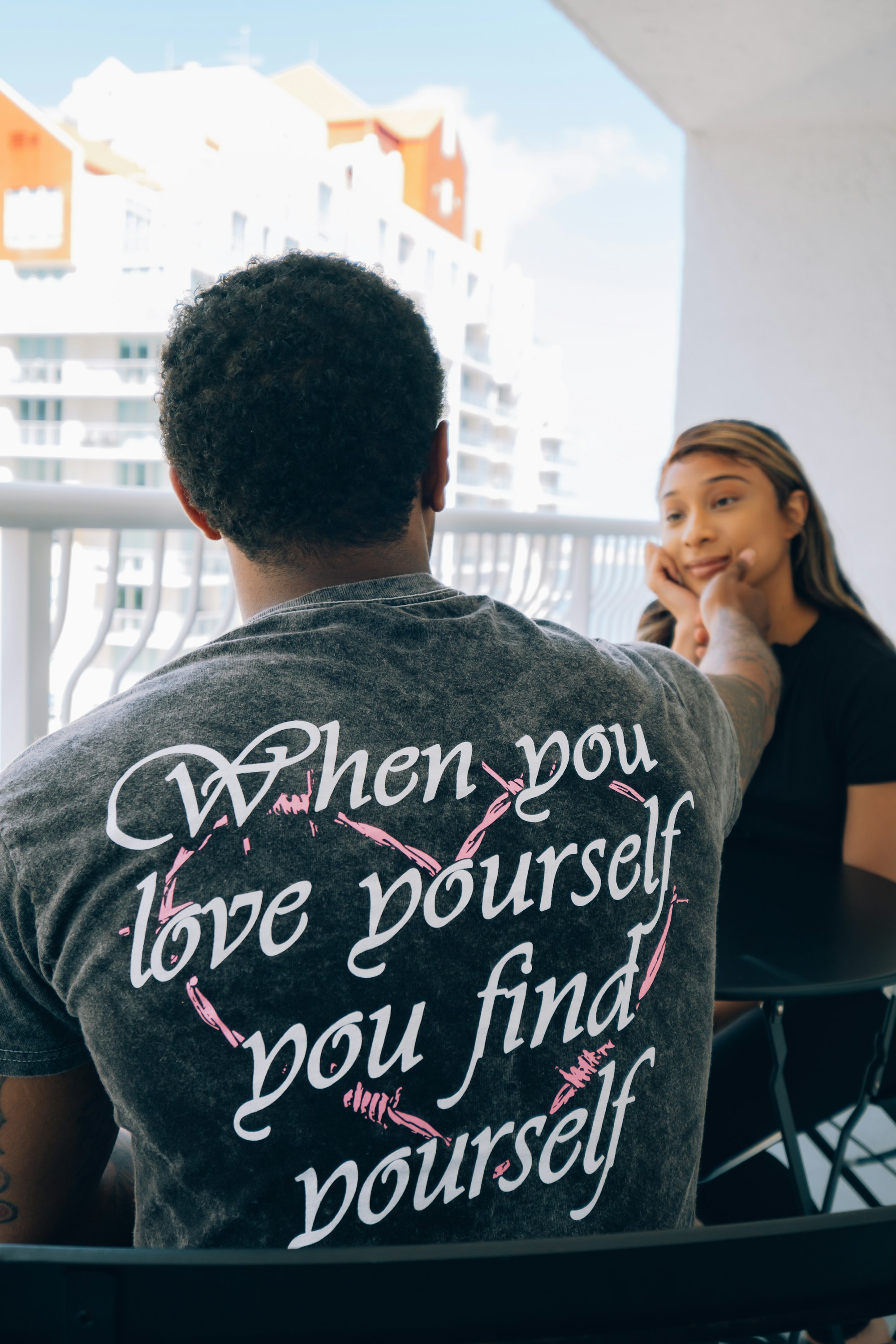 Why Doesnβt Anybody Talk About How Hard Love Is? 29 | Mania Africa | maniainc.com man in gray crew neck t-shirt sitting beside woman in black shirt | Why We Need to Talk About How Hard Love Is | Love & Relationships on Mania Africa