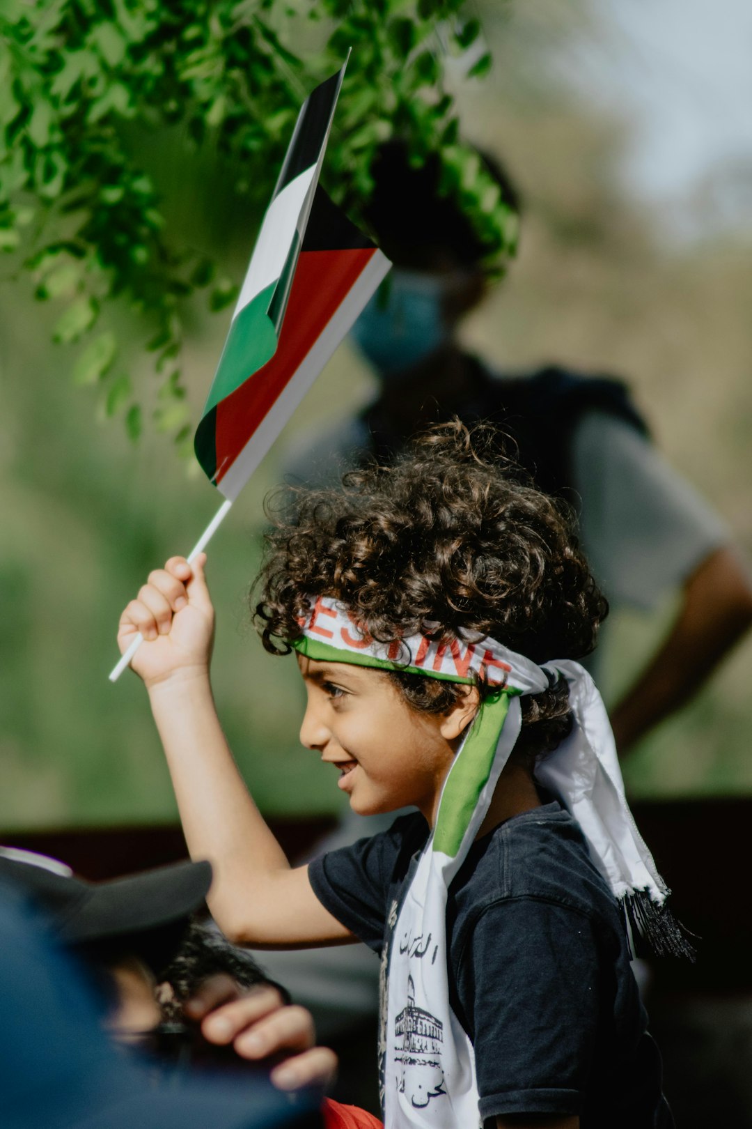 No Israel.. No More Violence.. Give Palestinians Their Country Back! 2 | Mania Africa | maniainc.com boy in blue and white shirt holding flag of us a during daytime