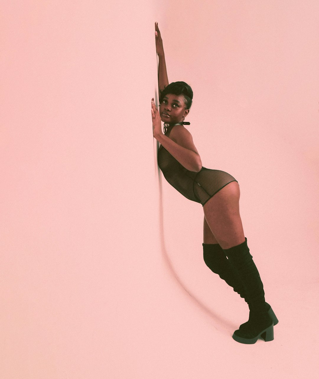 The Sex Diaries #3: How to Get What You Like During Sex 7 | Mania Africa | maniainc.com a woman in a short skirt and knee high boots leaning against a wall