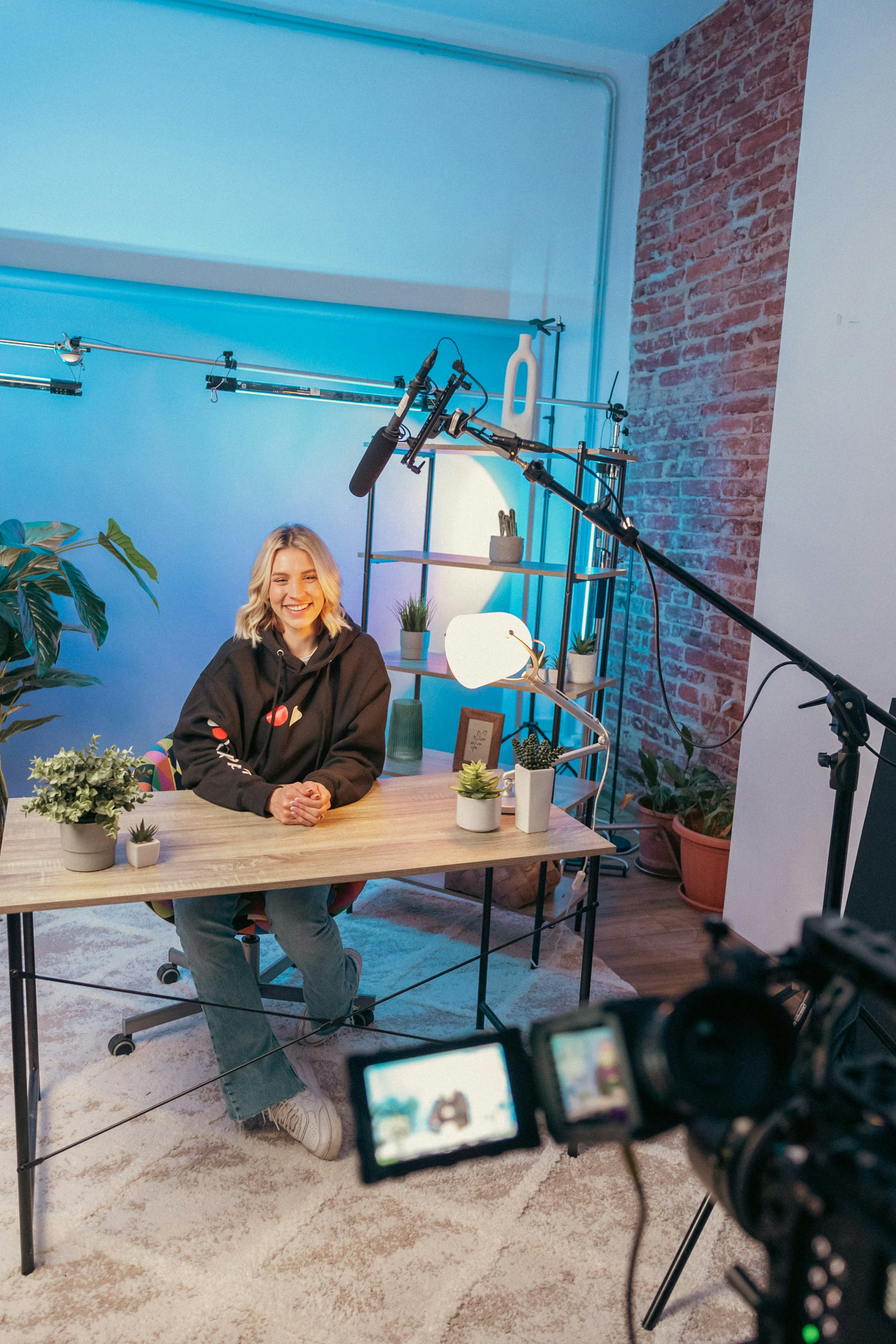 Mastering YouTube Titles: Boost Your Search Results with These Expert Tips 14 | Mania Africa | maniainc.com A creator recording a YouTube video | Tips and Hacks for Optimizing YouTube Video Titles | Mania Guides