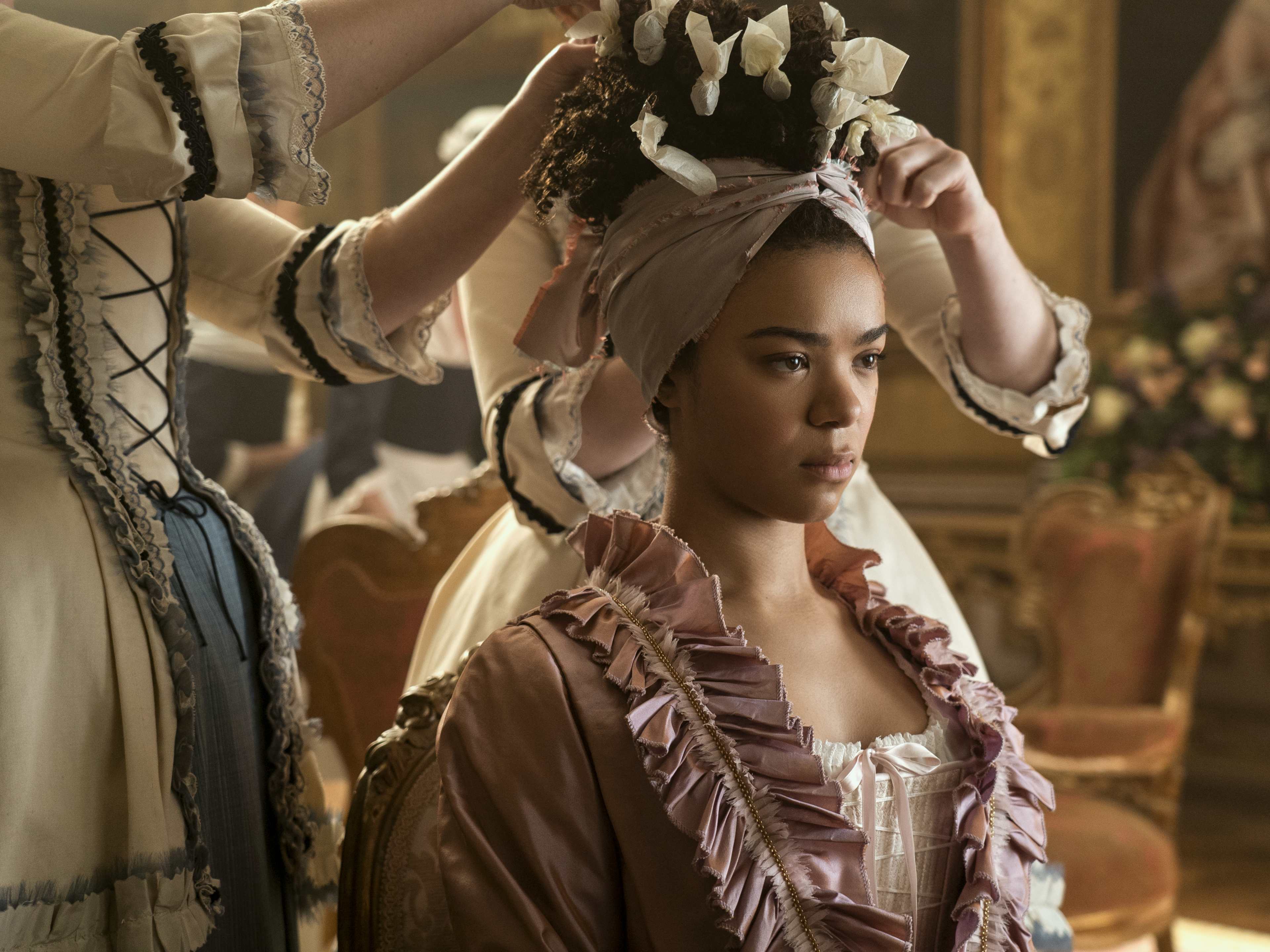 Queen Charlotte: A Bridgerton Story Review 3 | Mania Africa | maniainc.com Queen Charlotte quickly becomes accustomed to the pampered life and being waited on | Queen Charlotte Review | Mania Movies