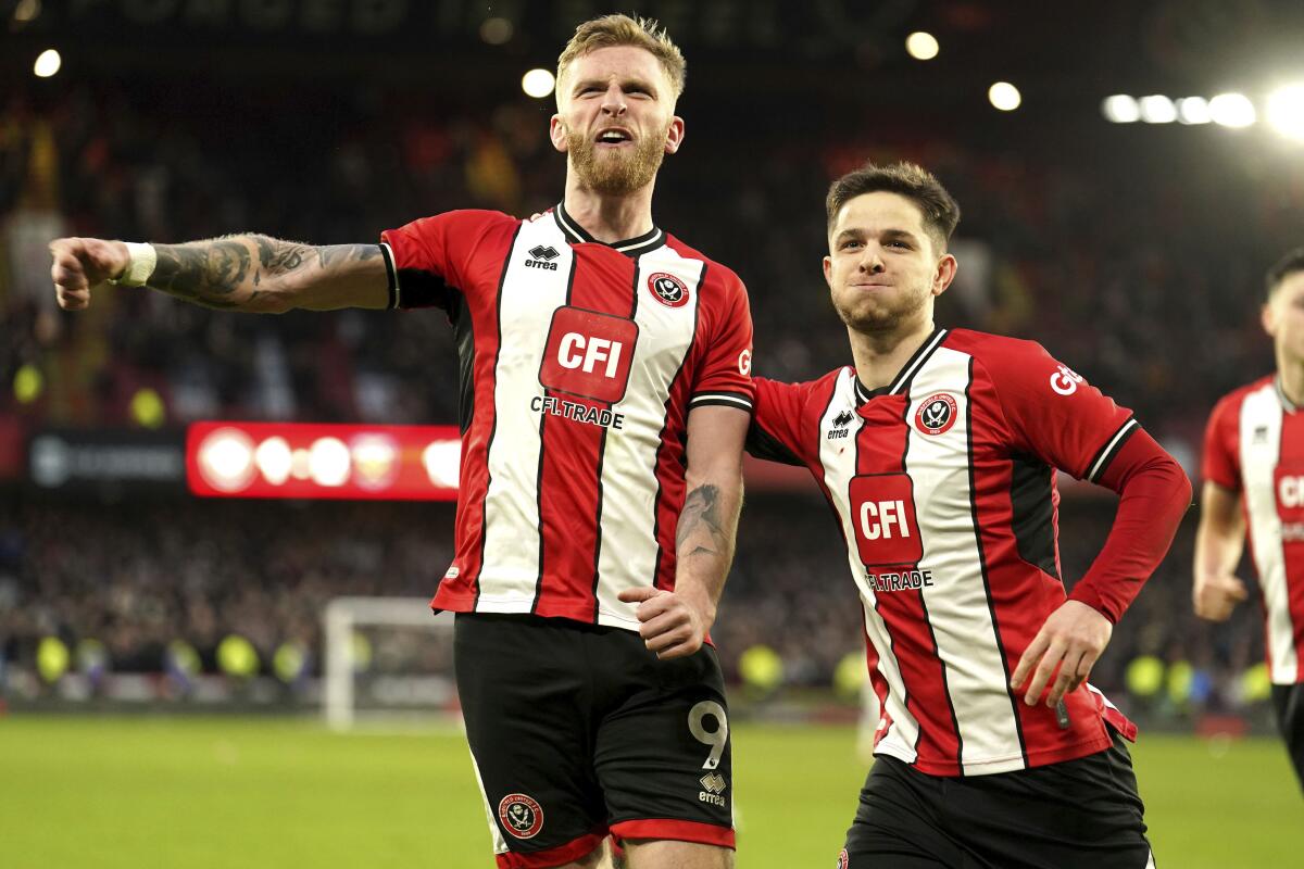 Arsenal Thrash Crystal Palace as Liverpool Nick Bournemouth in the Last of EPL GW 21 Results 6 | Mania Africa | maniainc.com Oli McBurnie celebrating his penalty conversion against West Ham | EPL Updates | EPL 2023/24 | Mania Africa